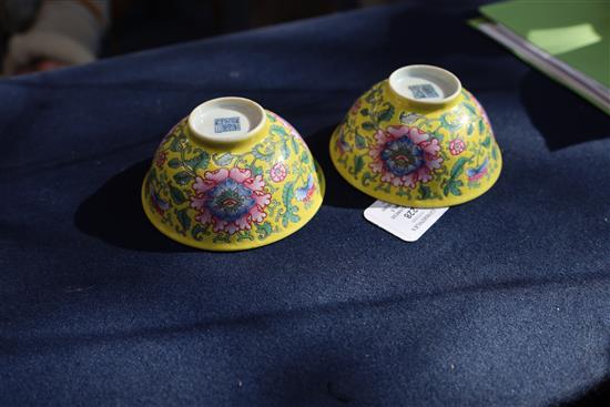 A pair of Chinese yellow ground famille rose bowls, Daoguang six character seal mark and probably of the period (1821-50), Diam.11.5cm